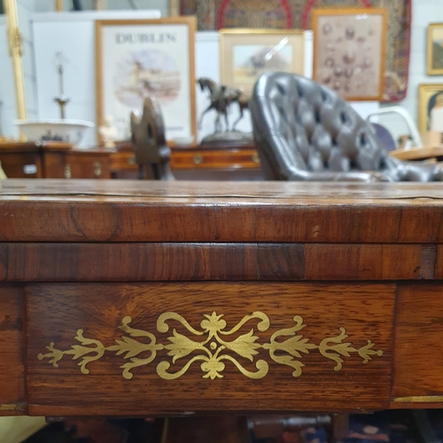 951 - Of good quality. A Regency Mahogany Foldover Card Table with brass inlay top and frieze on quatrefoi... 