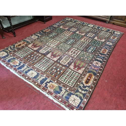 959 - A multi ground Persian Carpet with a traditional panel garden design, 293 x 203 cm approx.