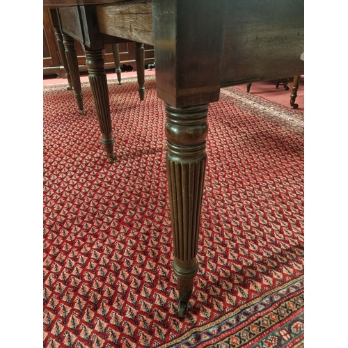 1008 - A good early 19th Century period Regency telescopic Dining Table with turned reeded supports and bra... 