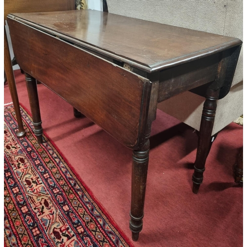 1068 - An early 19th Century Mahogany Pembroke Table with turned supports and single frieze drawer.
H 66 x ... 