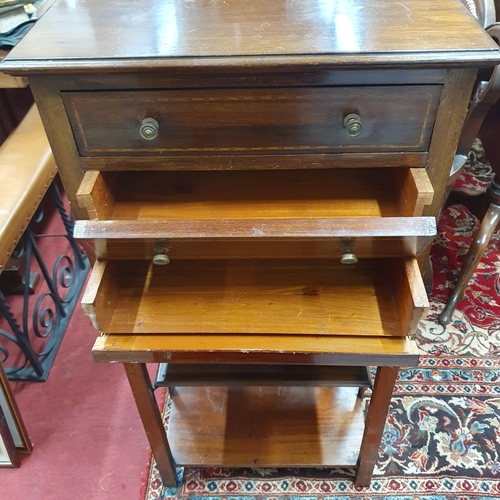 39 - An Edwardian Mahogany and Inlaid Music Cabinet with four fall flap drawers on square supports.
W 53 ... 