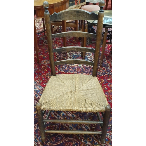 64 - An early 19th Century Provincial single Chair with a rush seat. W 47 x SH 38 x BH 92 cm approx.