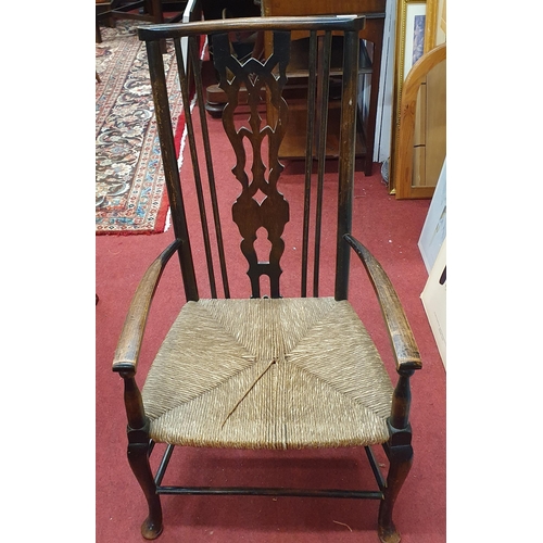 65 - A late 19th Century Provincial single Armchair with a rush seat. W 47 x SH 31 x BH 87 cm approx.