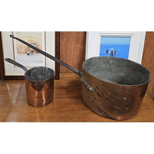 436 - A very large 19th, possibly 18th Century, large Copper Pot with cast iron handle along with another.... 