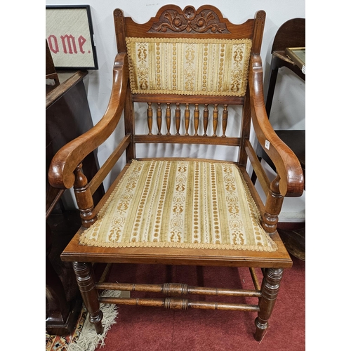 441 - A good pair of early 20th Century Walnut Arts and Crafts Armchairs with turned front supports and pa... 