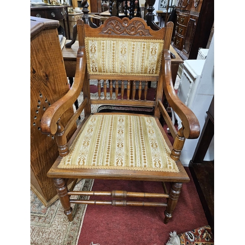 441 - A good pair of early 20th Century Walnut Arts and Crafts Armchairs with turned front supports and pa... 