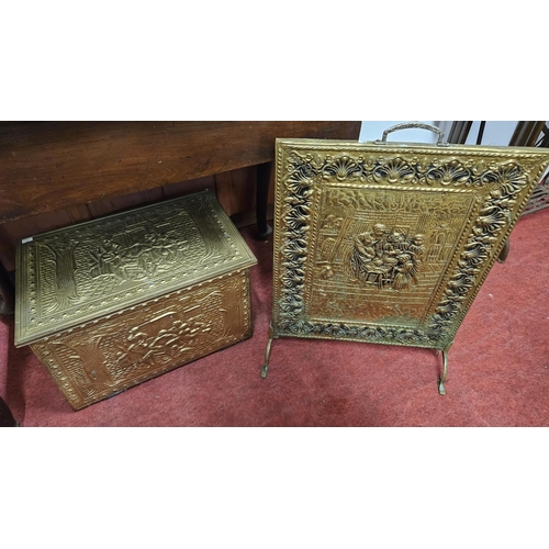 478 - Two embossed Brass Coal Bins along with a fire screen. W 46 x 30 x H 31 cm approx.