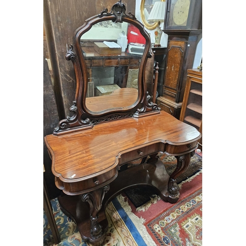 544 - A Superb 19th Century Mahogany Dressing Table with drawered frieze carved cabriole front supports an... 