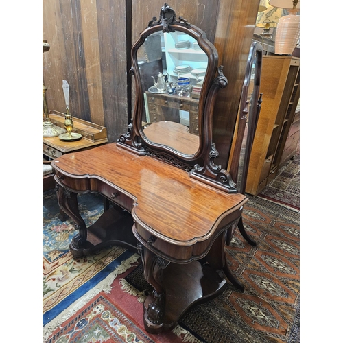 544 - A Superb 19th Century Mahogany Dressing Table with drawered frieze carved cabriole front supports an... 