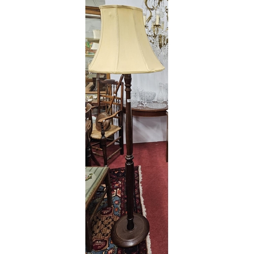 592 - A modern Mahogany Standard Lamp. H 172 cm approx.