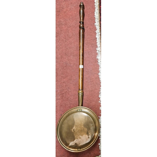 596 - A 19th Century Copper Warming Pan. H 107 cm approx.