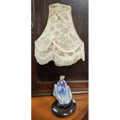 609 - A 19th Century Royal Doulton Figure of a woman on a table lamp base and shade. H 44 cm approx.