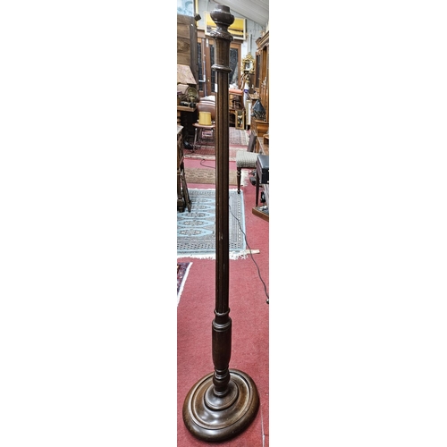 610 - An early 20th Century Standard Lamp with turned reeded fluted support and circular platform base.
H ... 