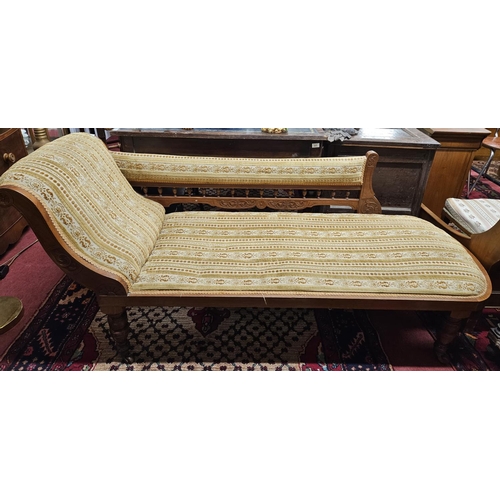 612 - An early 20th Century Arts and Crafts Chaise Longue on turned supports on simple form. L 173  cm app... 