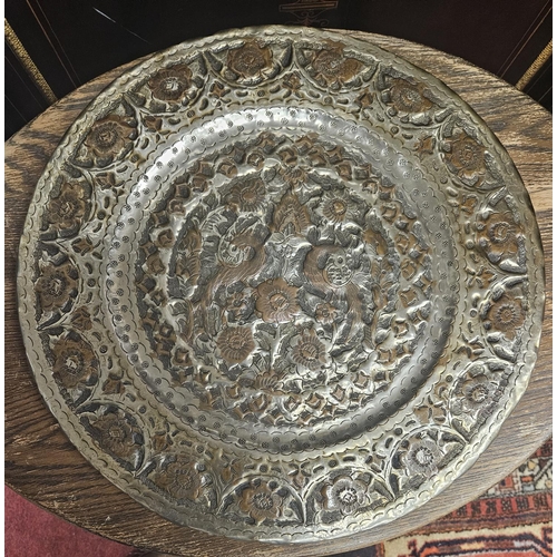 84 - An early 20th Century oval Table along with a metal Plaque. H 47 x 45 x 60 cm approx.