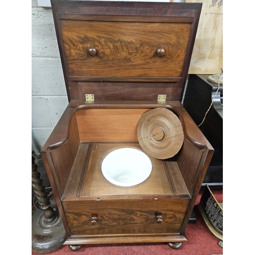 99 - A good early 19th Century Mahogany Commode on turned supports with lift up lid. Can be used as a sid... 