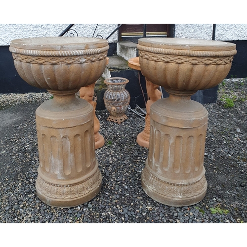 1096 - A Pair of Reconstituted Stone Garden Urns on Pedestals, can be for inside or outside. H 100 x D 55 c... 