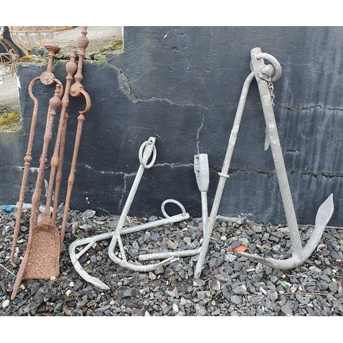 1099 - A Group of Irons to include Anchors and Fire Irons. H 64 cm approx.