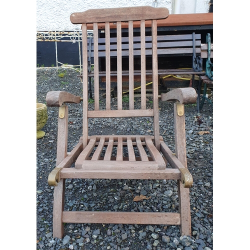 1100 - A Teak Garden Seat/Lounger. Along with 2 parasol bases. H 90 x 57 x 80 cm approx.