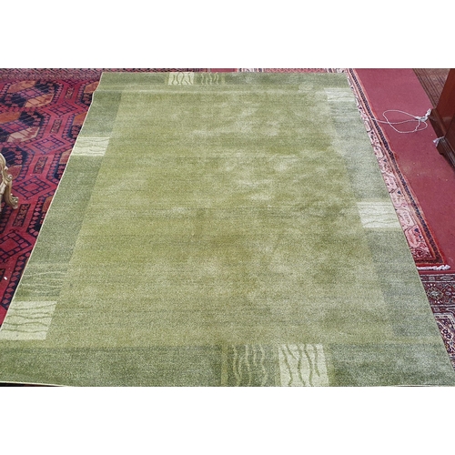 1153 - A green ground 'Loft Collection' Turkish made Carpet. L 304 x W 215 cm approx.