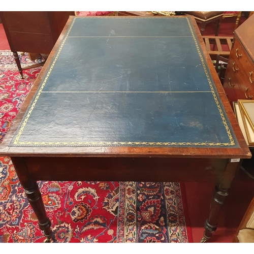 615 - A really good Regency Mahogany and veneered Writing Table on turned supports with tooled leather top... 