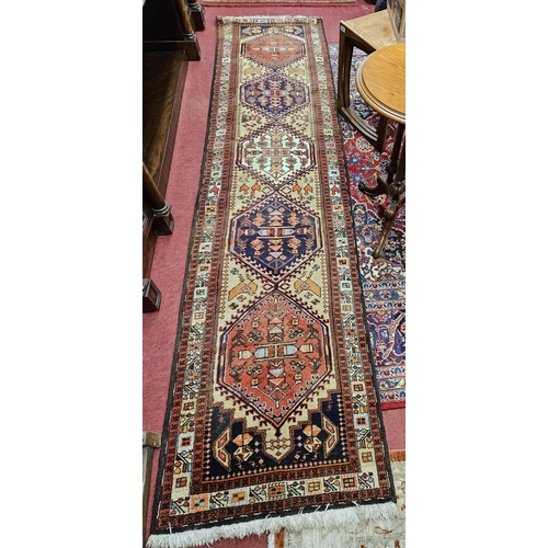 85 - A Superb red ground Persian Runner with multi borders and unique medallion central design.
L 320 x W... 