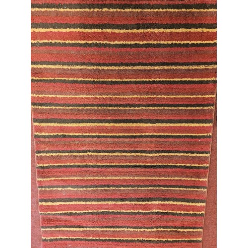 450A - a modern Red ground Rug.