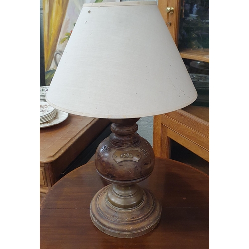 471 - An early 20th Century Timber Table Lamp with brass turnings. H 50 cm approx.