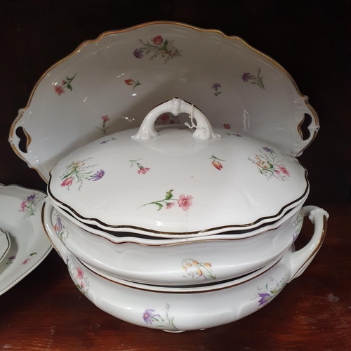 529A - A Fantastic Limoges Dinner Service with floral pattern outline and gilded banding. Approx. 70 pieces... 