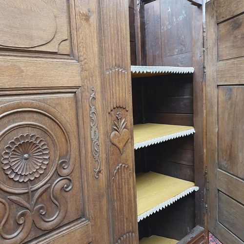 531 - A Magnificent 19th Century Oak Armoire with highly carved outline, panelled doors and fluted outline... 