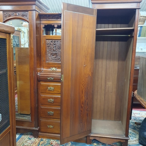 542 - A Superb 19th Century Walnut two door Wardrobe with highly carved centre flanked by twin bevelled mi... 