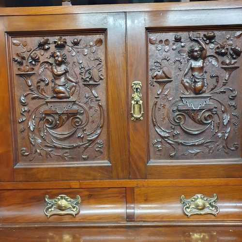 542 - A Superb 19th Century Walnut two door Wardrobe with highly carved centre flanked by twin bevelled mi... 