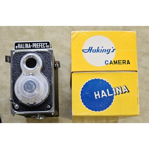 429A - A Halina Harking's Camera, Hanimex Electra 1 Camera, Hanimex Slide Projector along with a Kodak Brow... 