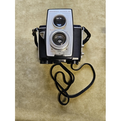 429A - A Halina Harking's Camera, Hanimex Electra 1 Camera, Hanimex Slide Projector along with a Kodak Brow... 