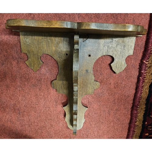 593 - A small Walnut wall Bracket. H 26 x W 27 cm approx.