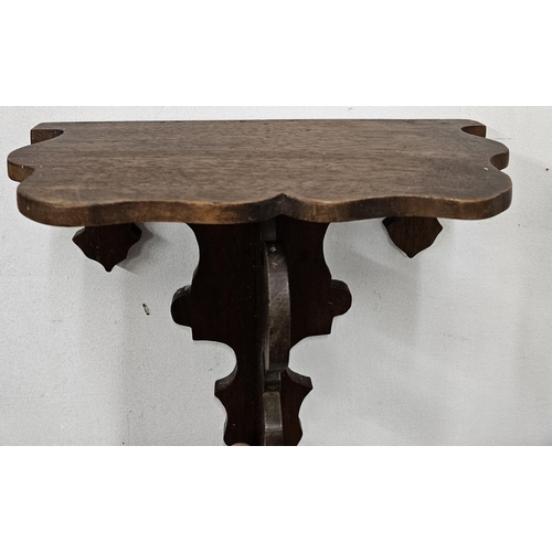 593 - A small Walnut wall Bracket. H 26 x W 27 cm approx.