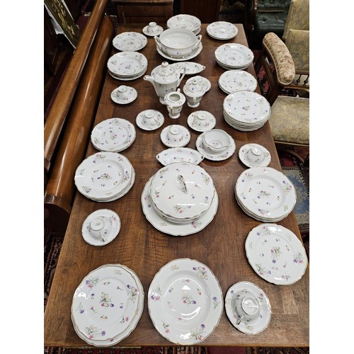 529A - A Fantastic Limoges Dinner Service with floral pattern outline and gilded banding. Approx. 70 pieces... 