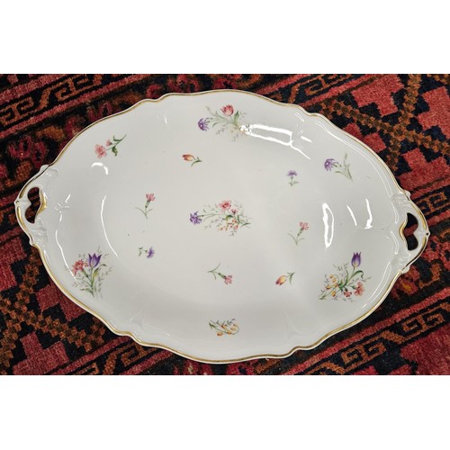 529A - A Fantastic Limoges Dinner Service with floral pattern outline and gilded banding. Approx. 70 pieces... 