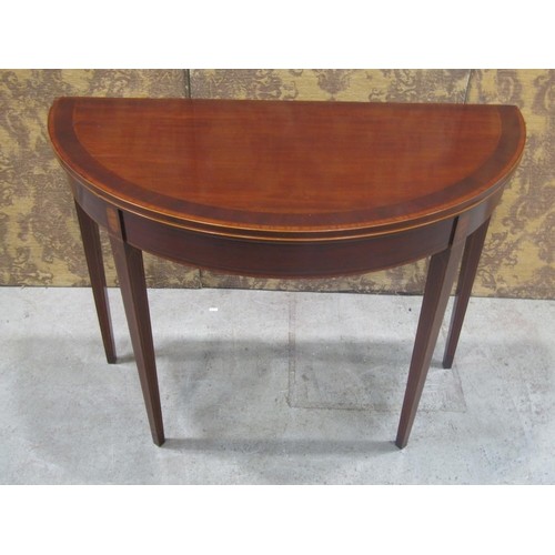 594 - A good early 19th Century Mahogany and Inlaid Foldover Card Table on square tapered supports. W 99 x... 