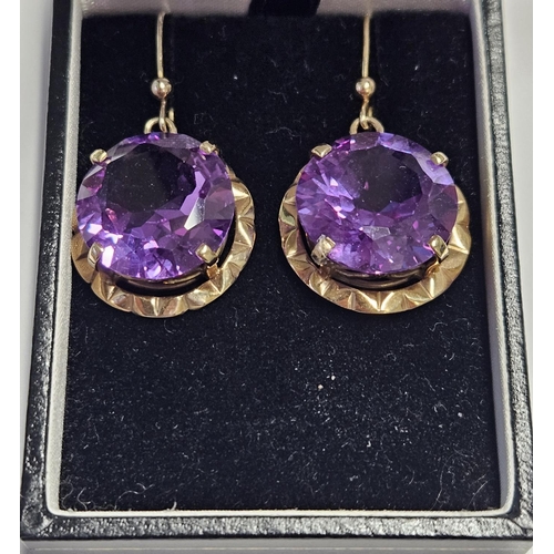 205 - A lovely pair of very large Amethyst drop Earrings set in 9ct Gold.