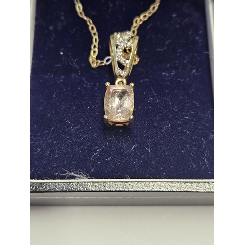 206 - A 9ct Gold. Diamond Pendant.