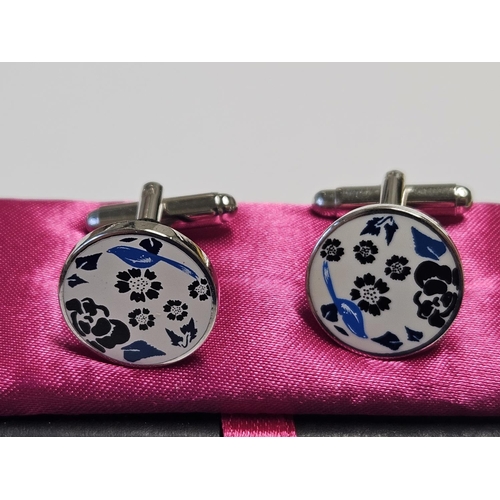 214 - A pair of designer Cufflinks.