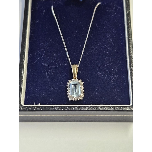 216 - A 9ct Gold, Diamond and Aquamarine Pendant.