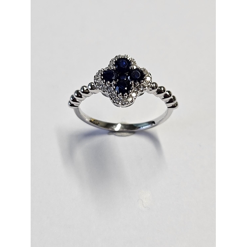 220 - A 9ct Gold, Diamond and Sapphire cluster Ring, size M1/2.