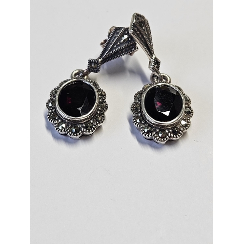 222 - A pair of Silver and Garnet set Earrings.