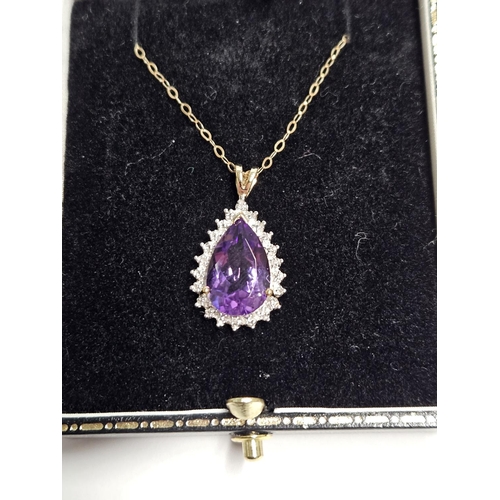 227 - A 9ct Gold, Diamond and Amethyst Pendant and a 9ct Gold Chain.