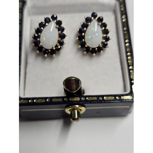 228 - A nice pair of 9ct Gold, Opel and Sapphire Earrings.