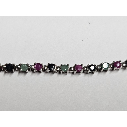 229 - A Silver and Gem set tennis Bracelet.