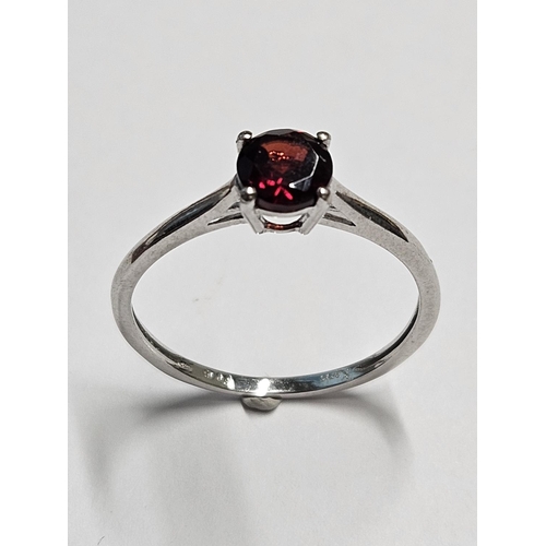 231 - A 9ct Gold Solitaire set with a single Garnet.