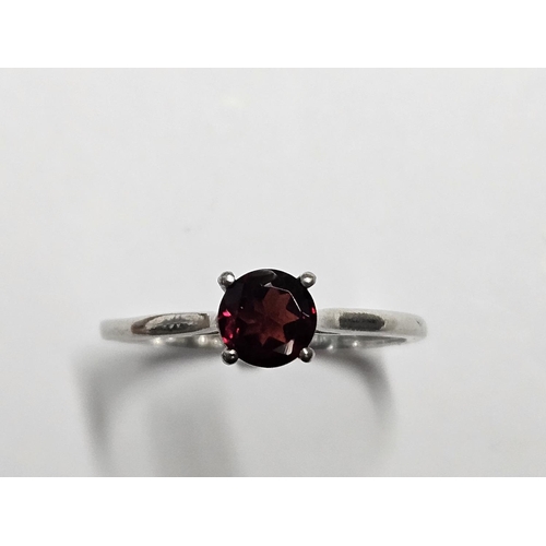 231 - A 9ct Gold Solitaire set with a single Garnet.